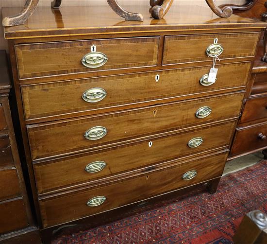 A George III inlaid and crossbanded mahogany chest of drawers W.119cm